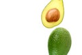 Two halves of avocado on a white background