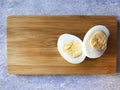 two halves of a boiled egg on a board Royalty Free Stock Photo