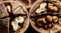 Two halves of a cracked walnut showing the textured shell and kernels inside Royalty Free Stock Photo