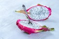 Two halves of dragon fruit with spoon on white background, tropical fruit Royalty Free Stock Photo