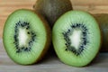 Two halves of fresh kiwi on a wooden table Royalty Free Stock Photo