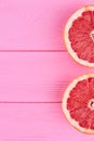 Two halves of grapefruit and copy space. Royalty Free Stock Photo