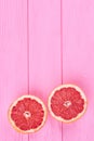 Two halves of grapefruit, top view. Royalty Free Stock Photo