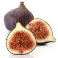 Two halves and one whole fig fruit on a white background. Full depth of field. Royalty Free Stock Photo