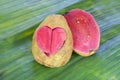 Two halves pink guava with carved heart Royalty Free Stock Photo