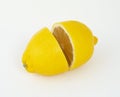 Two halves of ripe fragrant citrus lemon on a white background