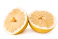 Two halves of ripe pomelo on a white, . Royalty Free Stock Photo