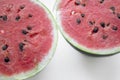 Two halves of watermelon on a white background. Ripe waterbeuse with seeds. Summer berry - red watermelon. Royalty Free Stock Photo