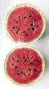 Two halves of watermelon on a white background. Ripe waterbeuse with seeds. Summer berry - red watermelon. Royalty Free Stock Photo