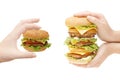 Two hamburgers in hands Royalty Free Stock Photo