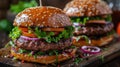 Two Hamburgers on Wooden Cutting Board Royalty Free Stock Photo