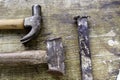 Two hammers lined up on aged wood as a background Royalty Free Stock Photo