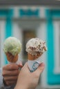 Two hand carry the clone of ice cream and joy to shoot photo with other clone