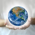 Two hand hold the earth ,including elements furnished by NASA Royalty Free Stock Photo