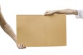 Two hand holding blank brown paper isolated on white background Royalty Free Stock Photo