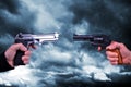 Two hand holding gun revolvers. Royalty Free Stock Photo