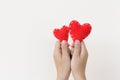 Two hand holding two red heart on white background. Royalty Free Stock Photo