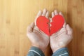 Two hand of man holding a paper broken heart Royalty Free Stock Photo