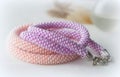 Two handmade necklaces from pink and lilac beads