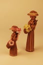 Two handmade straw figure of a lovely woman wearing a hat