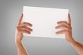Two hands catching white sheet with stretched fingers isolated background Royalty Free Stock Photo