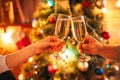 Two hands clink glasses with champagne, christmas Royalty Free Stock Photo