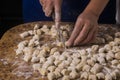 Some hands making gnocchi. traditional italian dish