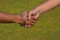 Handshaking moments with green background stock photograph