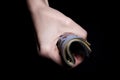 two hands with dollars. Closeup female hand giving money for something with isolated on black background,count, paying, shopping Royalty Free Stock Photo