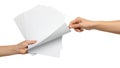 Two hands exchanging a stack of blank documents or papers Royalty Free Stock Photo