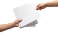 Two hands exchanging a stack of blank white documents Royalty Free Stock Photo