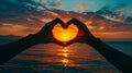 Two Hands Forming Heart Shape at Sunset Royalty Free Stock Photo