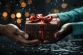 Two hands give two other hands a christmas gift box. Concept merry christmas and happy new year