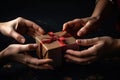 Two hands give two other hands a christmas gift box. Concept merry christmas and happy new year