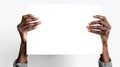 Hands hold a Juneteenth banner against a white background signifying freedom and celebration of African American history Royalty Free Stock Photo