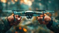 Two Hands Holding a Green and Black Drone Royalty Free Stock Photo