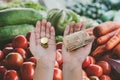 Two hands are holding money in the supermarket. shopping concept. hryvnia on the palms. The concept of not enough money, crisis. Royalty Free Stock Photo