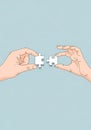 Two hands holding puzzle pieces, about to connect them to form a solution and solve problems Royalty Free Stock Photo