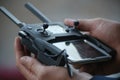 Arajuno, Ecuador, 12-10-2020: Two hands that are holding a remote control of a drone Royalty Free Stock Photo