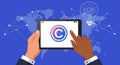 Two hands holding a tablet displaying a copyright symbol. Background features a