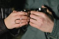 Two hands are holding two cups Royalty Free Stock Photo
