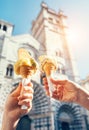 Two hands with ice cream on the San Lorenco Cathedral backgroun Royalty Free Stock Photo