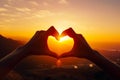 Two hands making heart shape with the sun setting in the back ground. Generative AI Royalty Free Stock Photo