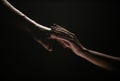 Two hands at the moment of farewell. The holding hands of relations. Help friend through a tough time. Rescue gesture Royalty Free Stock Photo