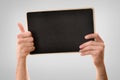 Two hands catching blackboard ok sign isolated gray background Royalty Free Stock Photo