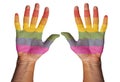 Two hands painted in LGBTQ rainbow flag colors reaching up in the air. Isolated on white background. Royalty Free Stock Photo