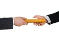 Two hands passing a golden relay baton Royalty Free Stock Photo