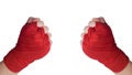 Two hands in protective red bandages clenched into a fist, front view, isolated on white background Royalty Free Stock Photo