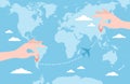 Two hands putting pin icons on a blue world map and an airplane flying on a route. Flat vector illustration Royalty Free Stock Photo