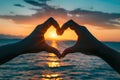 Hands Forming Heart Shape at Sunset Royalty Free Stock Photo